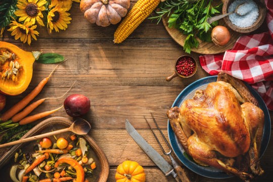 Thanksgiving food items on a rustic wooden table