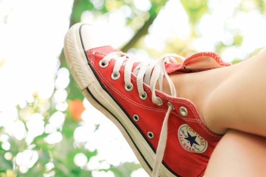 Close up of red Converse gym shoe
