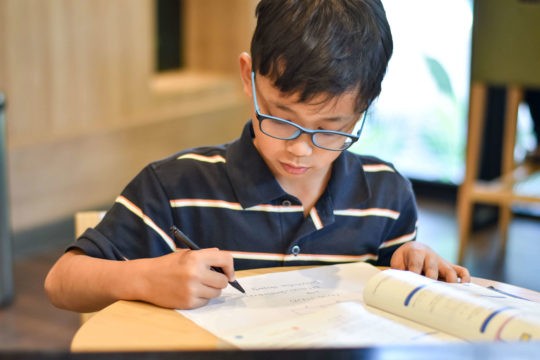 Young boy working on math homework