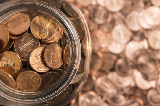 Close up of a jar of pennies